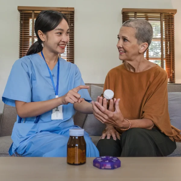 asian-caregiver-nurse-give-consult-to-caucasian-se-2025-01-16-13-14-16-utc